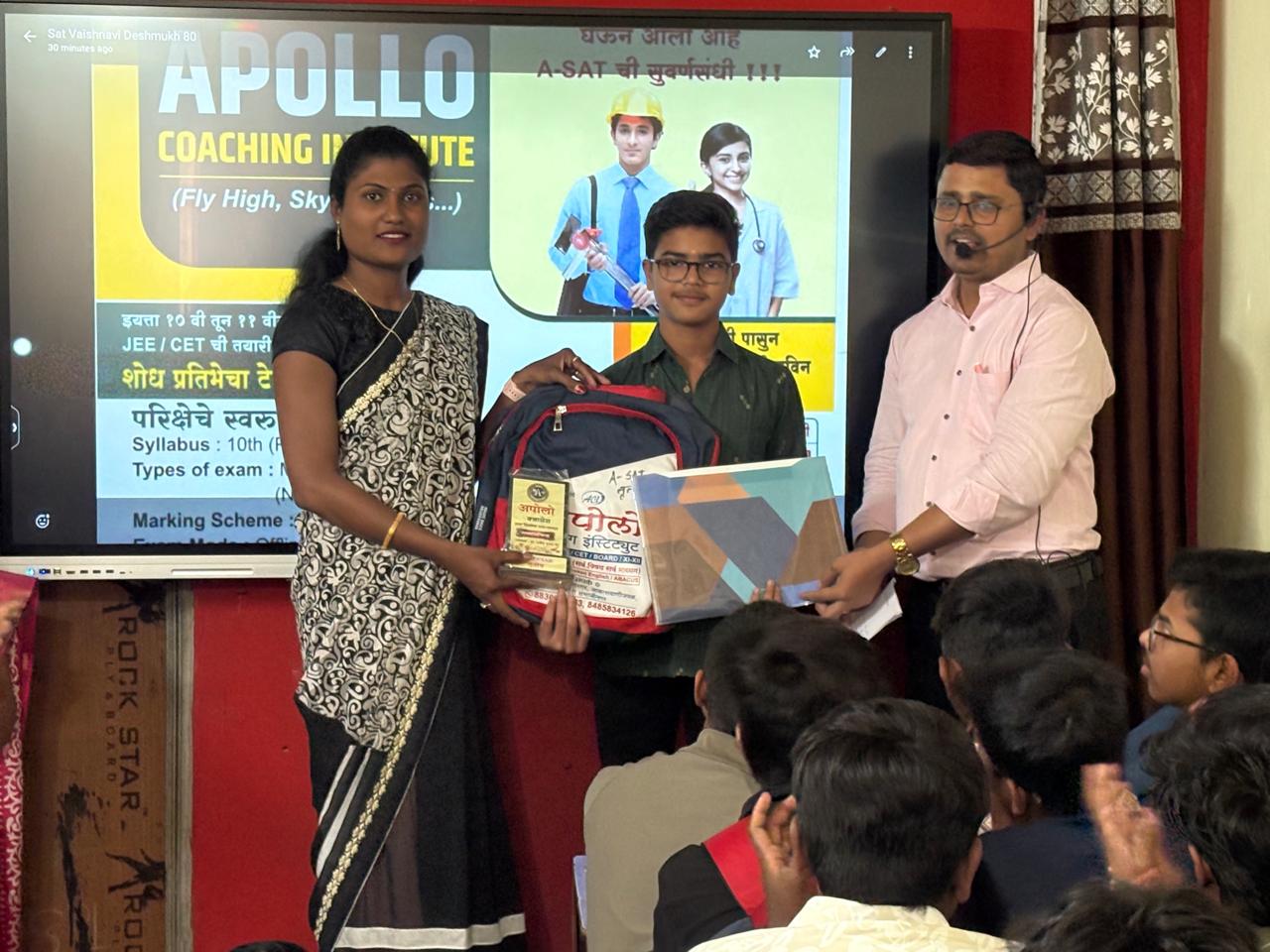 Students receiving awards on stage